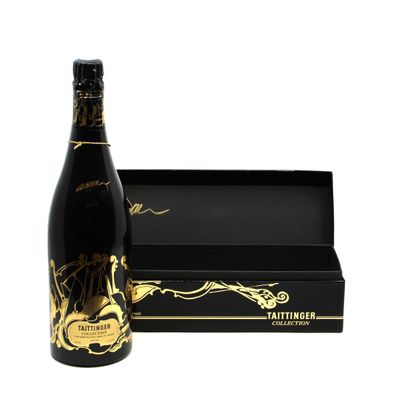 the bottle of champagne is next to a black box