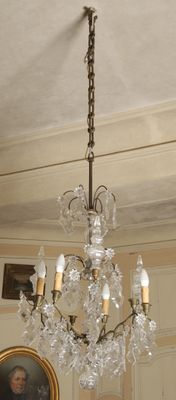 a chandelier hanging from the ceiling in a room