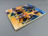 a close up of a painting on a table with a gray background