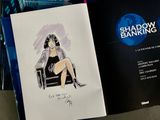 a drawing of a woman sitting in a chair in front of a book
