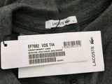 a close up of a label on a shirt that is on a hanger