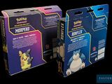 two boxes of pokemon trading cards are shown on a black background