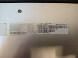 a label on the back of a laptop that has a barcode on it