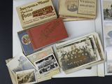 a lot of old photos on the table together