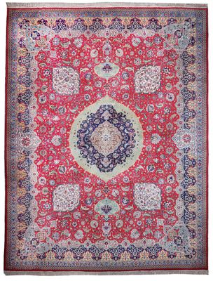 un tapis rouge et bleu à motif de médaillon