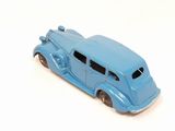 a blue toy car that is sitting on a white surface
