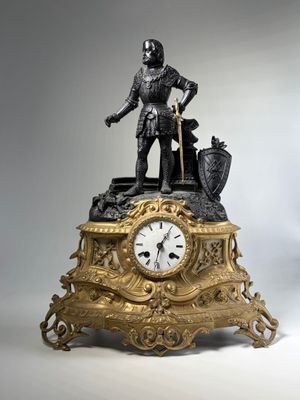 a statue of a man standing on top of a clock