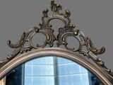 a mirror that is sitting in front of a window