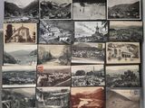 an old photo of a bunch of old photos hanging on a wall