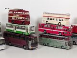 a lot of buses that are lined up in a row