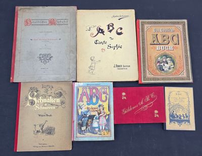 a lot of books that are sitting on a table