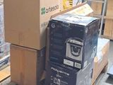 many boxes stacked on a pallet in a warehouse