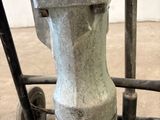 a close up of a parking meter on a cart