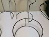 three chairs that are sitting on a white table