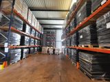 a large warehouse filled with lots of boxes and pallets