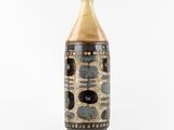 a vase with a brown and black design on it