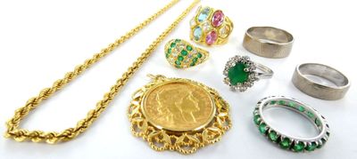 a lot of different rings and necklaces on the table