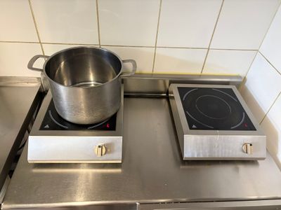 a pot on the stove with a pot on the burner