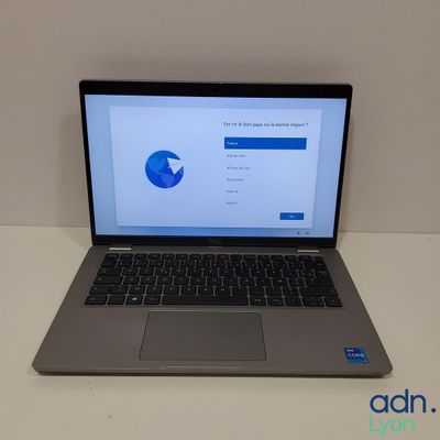 an open laptop computer sitting on top of a white table