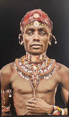 a picture of a man with a necklace on his neck