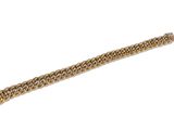 une image d'un bracelet en or sur fond blanc