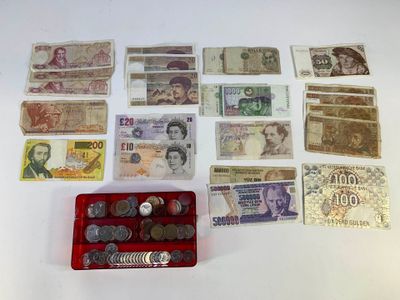 a lot of money and coins on the table