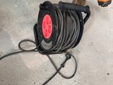 a hose that is sitting on the floor next to a hose