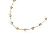 a close up of a gold necklace on a white background