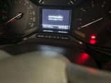the dashboard of a car with a digital display in the center