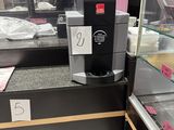 a coffee machine in the middle of the counter