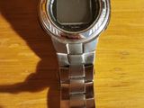 a watch that is sitting on a wooden table