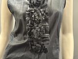 an image of a woman ' s top with a neck tie on it