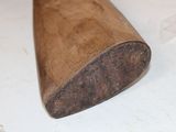 a wooden bat that is laying on a table