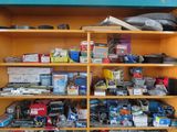 a shelf with many different types of electronics on it
