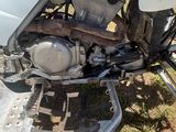 a motorcycle that is parked in the dirt