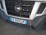 a close up of a car ' s grille with wires attached to it