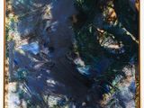 une peinture abstraite représentant un tableau bleu et vert posé sur un chevalet en bois