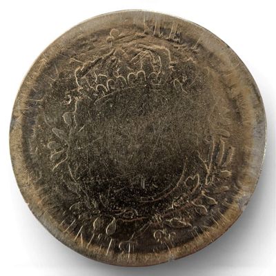 a close up of a metal object on a white surface