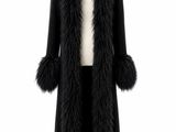 a black coat with fur collar and cuffs on a mannequin mannequin mannequin mannequin mannequin mannequin mannequin mann