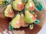 a plate with a bunch of pears on it