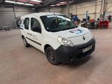 a small white van parked in a garage