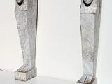 two statues of a man and a woman on display