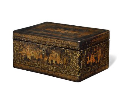 an old wooden box with a design of elephants on it