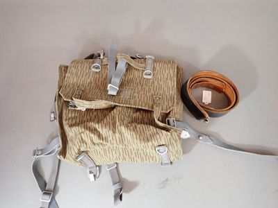 a small bag with a strap attached to it on a table