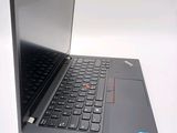 a laptop computer that is open on a white surface