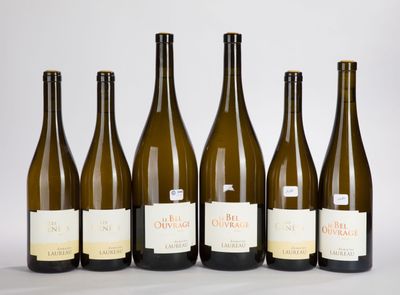 six bottles of wine are lined up in a row on a table