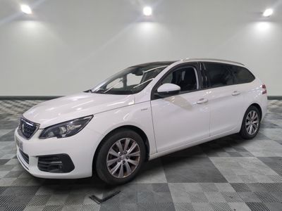 a picture of a white car parked in a garage