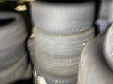 many tires stacked on top of each other in a warehouse