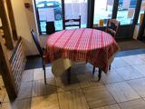 a table with a red and white checkered table cloth on it