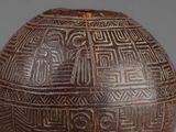 an image of a brown vase with designs on it